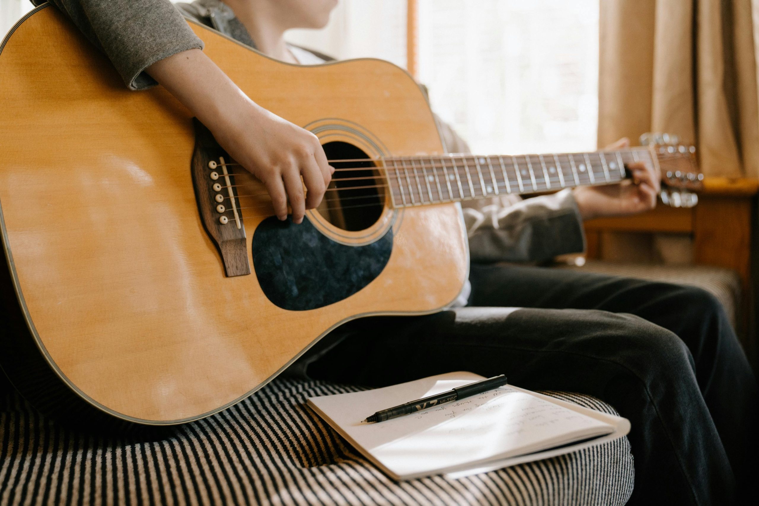 Person Playing Guitar